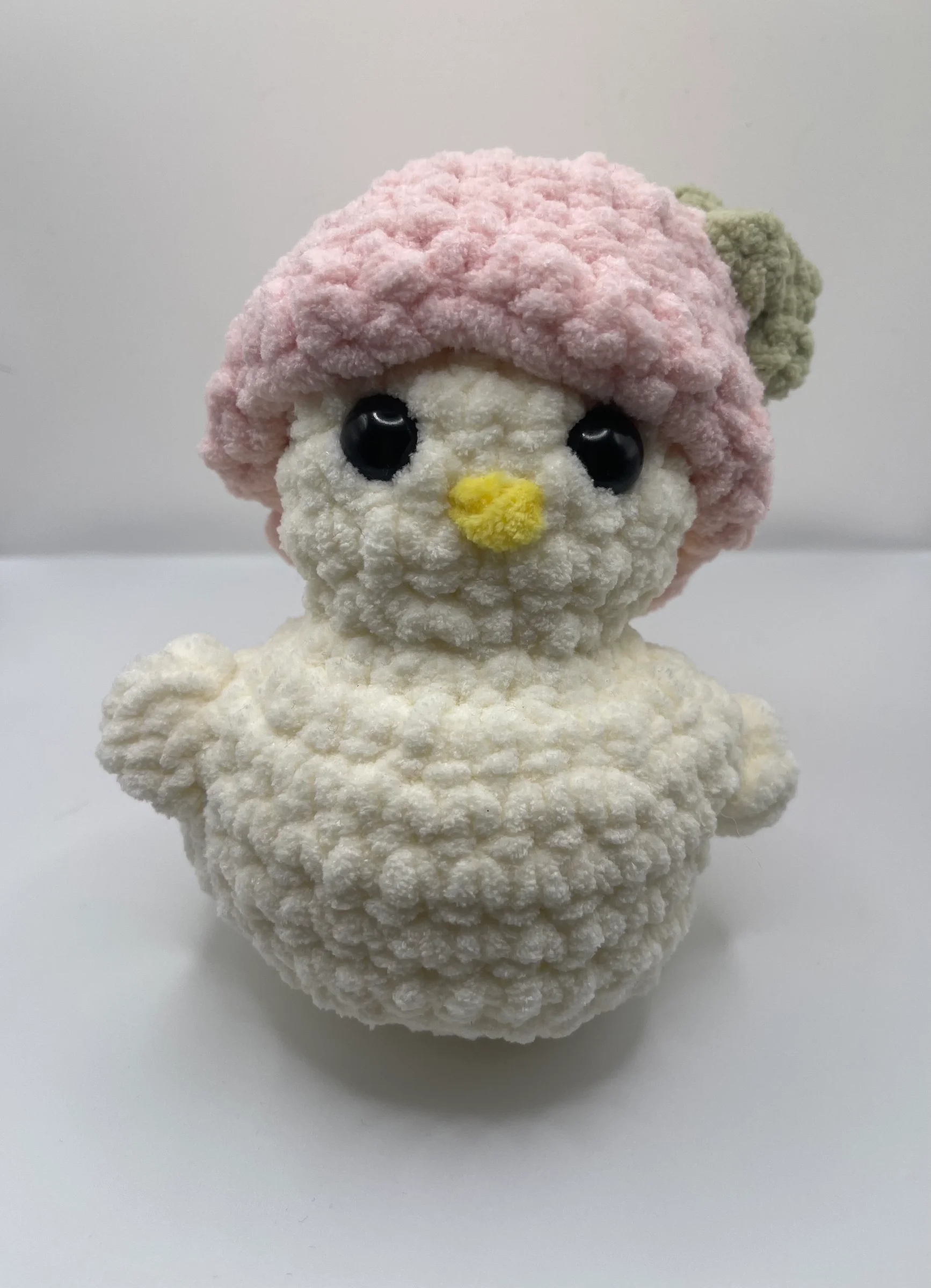 Meet Berry, a sweet little duck who never leaves the patch without her signature handmade strawberry cap! This chunky plushie is crafted from ultra-soft yarn, making her the perfect squishy companion for your desk or nightstand. She is officially ready to bring a touch of sweetness to her new foreve